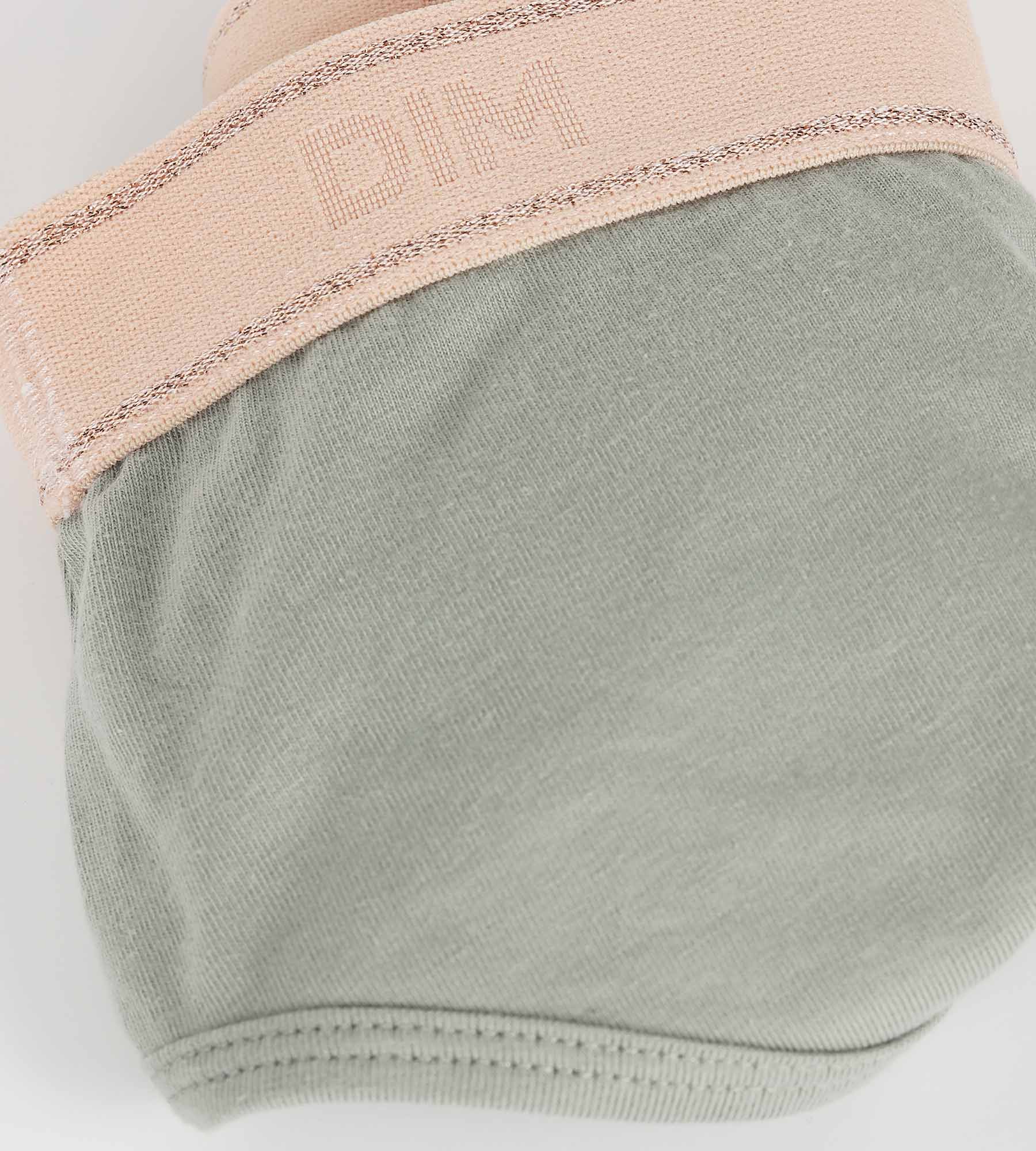 DIM Shorty da bambina in verde salvia e rosa Dim Sport