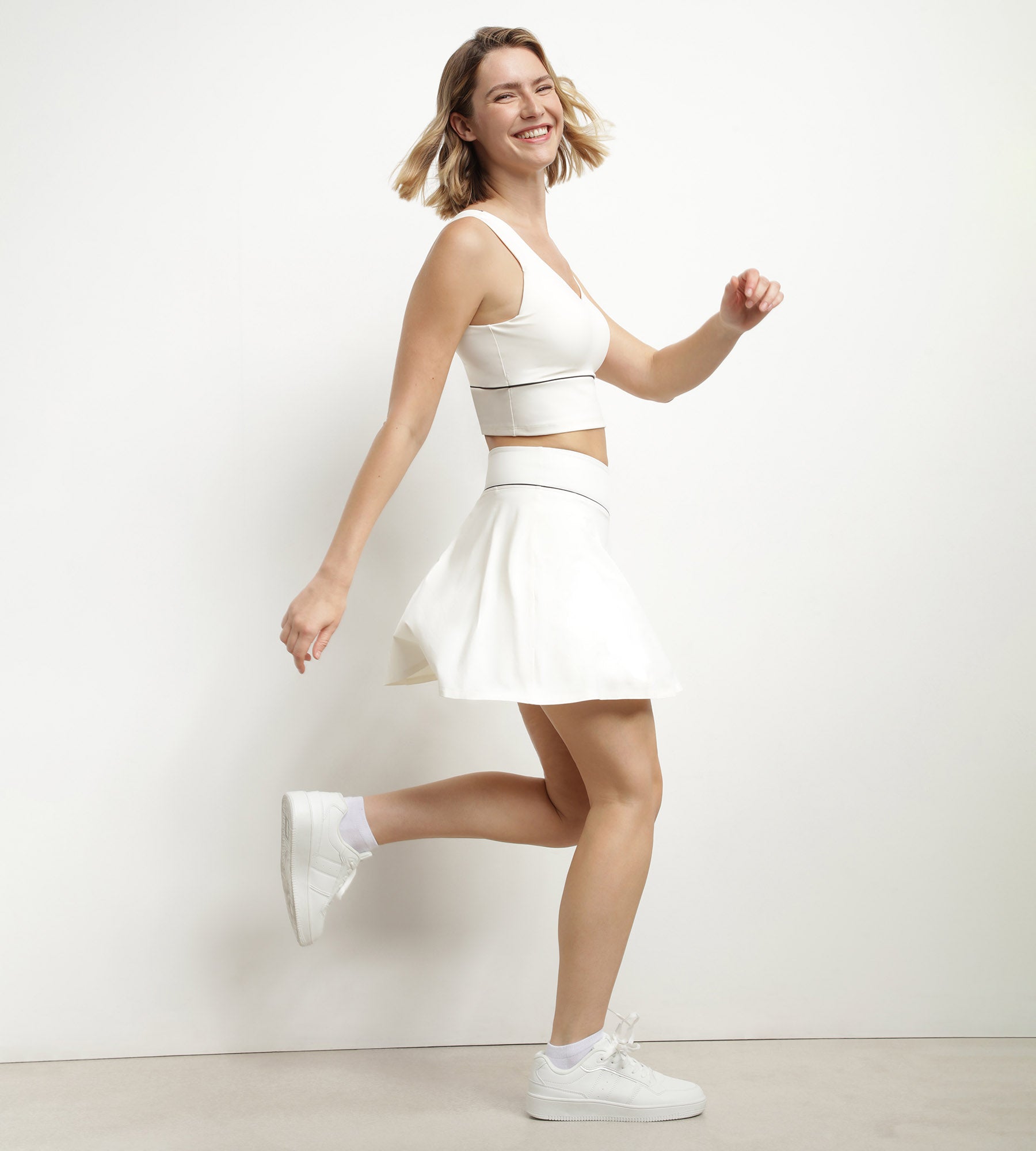DIM Reggiseno lungo modellante in microfibra ecrù DIM Move