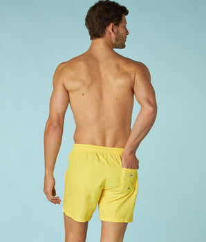 Pastel yellow swim trunks for men