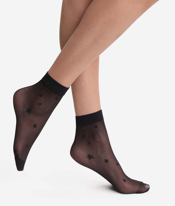 DIM Calzini neri trasparenti con motivo a stella Dim Style.